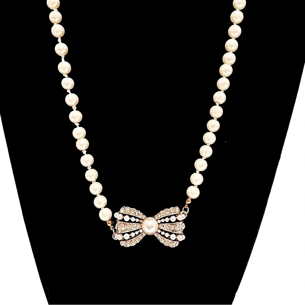 Miss Mandy's Double-Strand Ivory Pearl Necklace with Jeweled Bow Accent